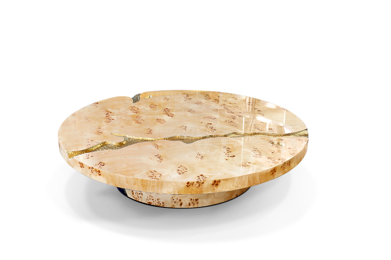 a marble modern coffe table with a gold detail in the middle coffee table
