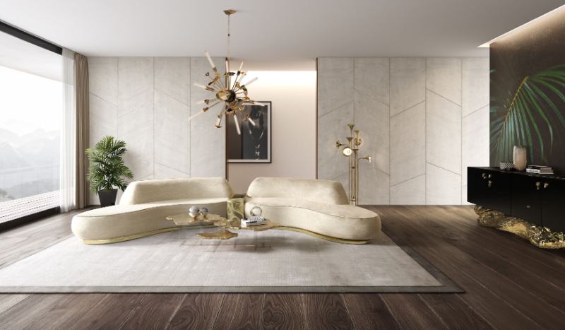 Living with neutral tones, a cream velvet sofa, gold details and a gold modern coffee table.